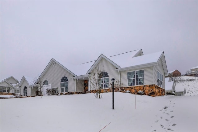 ranch-style home with stone siding