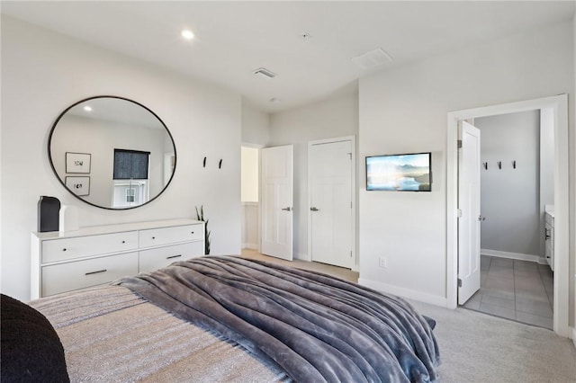 bedroom with recessed lighting, visible vents, light colored carpet, and baseboards