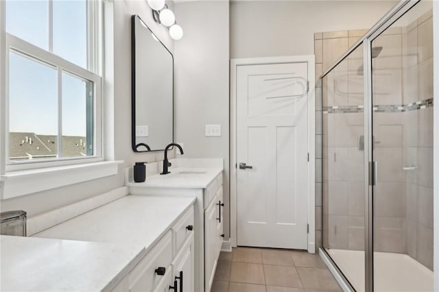 bathroom with vanity, a stall shower, and tile patterned flooring