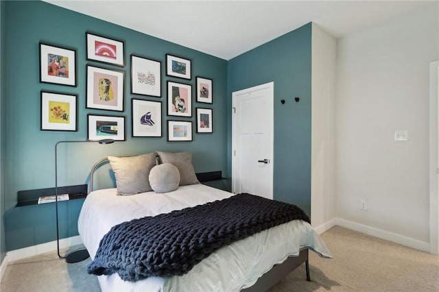 bedroom featuring carpet flooring and baseboards