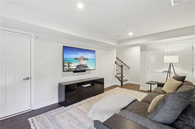 living area featuring stairway, recessed lighting, baseboards, and dark wood-style flooring