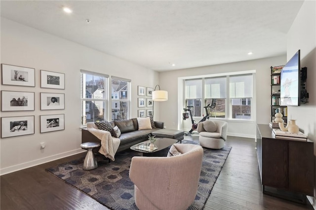 living room featuring recessed lighting, baseboards, and dark wood-style floors