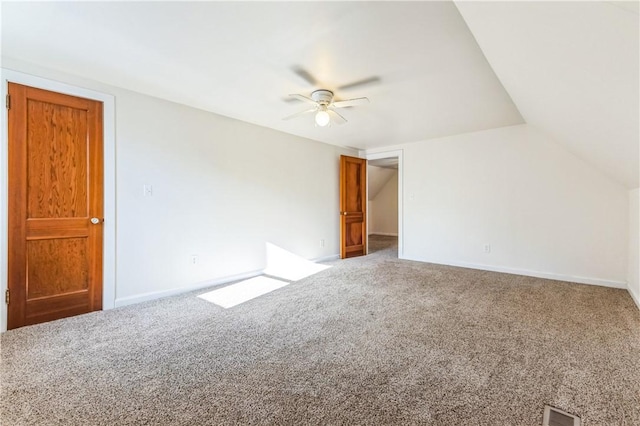 interior space with visible vents, baseboards, ceiling fan, and carpet flooring