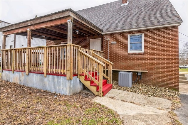 wooden deck with central air condition unit