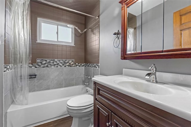 bathroom with toilet, shower / bath combo with shower curtain, vanity, and wood finished floors