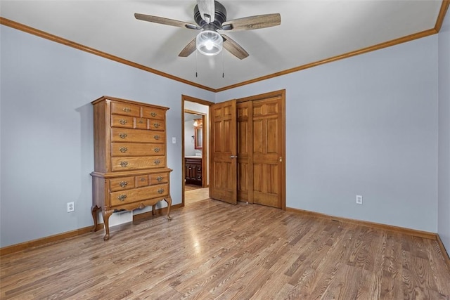 unfurnished bedroom featuring baseboards, light wood-style floors, and ornamental molding