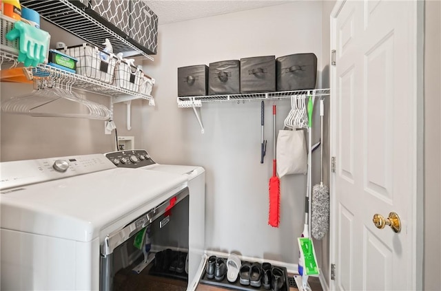 laundry area with laundry area and washing machine and clothes dryer