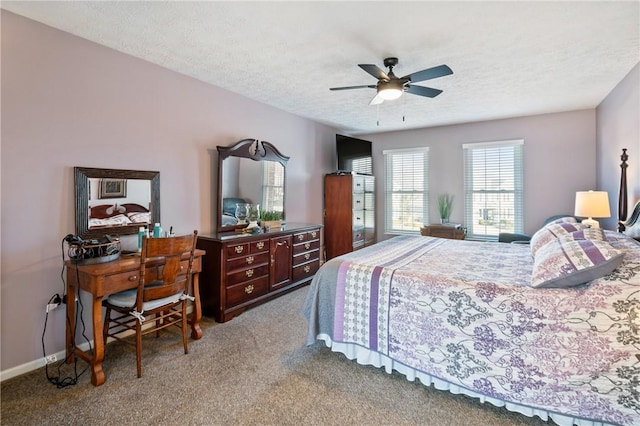 bedroom with baseboards, carpet, ceiling fan, and a textured ceiling