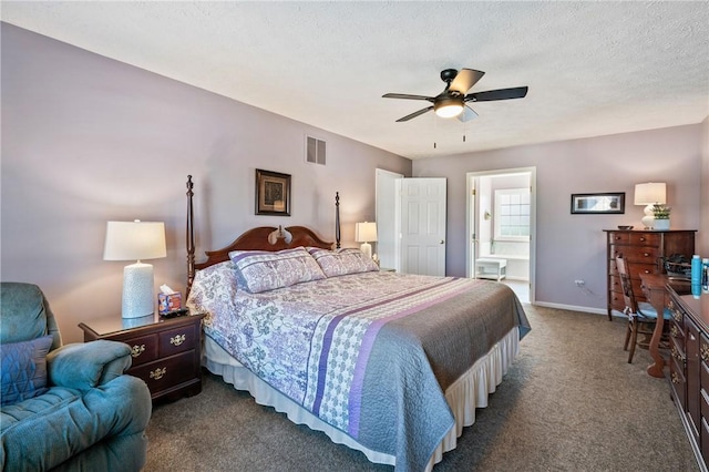 bedroom with baseboards, carpet flooring, a textured ceiling, ensuite bath, and a ceiling fan