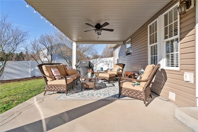 view of patio featuring a fenced backyard, ceiling fan, and outdoor lounge area