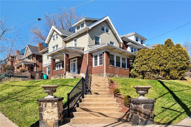 view of side of home with brick siding and a lawn