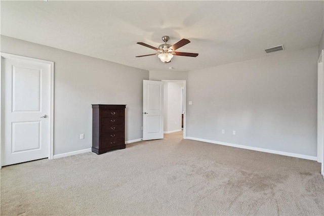 unfurnished bedroom featuring visible vents, ceiling fan, baseboards, and carpet floors