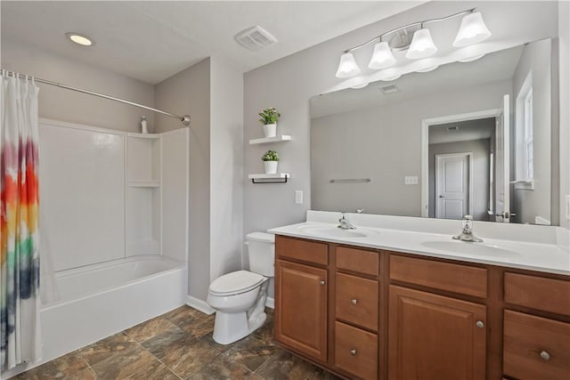 bathroom featuring double vanity, shower / tub combo, toilet, and a sink