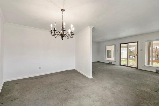 empty room with crown molding, a notable chandelier, baseboards, and dark carpet