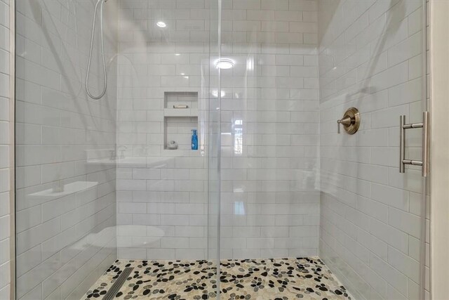 full bathroom featuring a shower stall