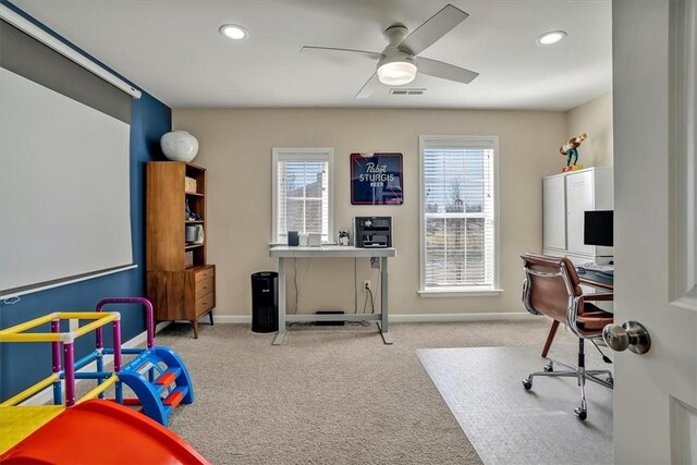 office space with visible vents, a ceiling fan, recessed lighting, carpet flooring, and baseboards