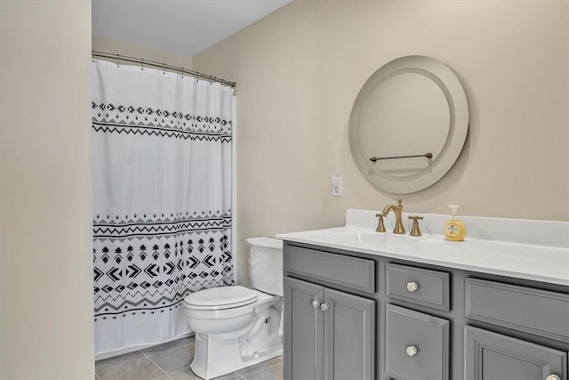 bathroom featuring vanity, curtained shower, toilet, and tile patterned flooring