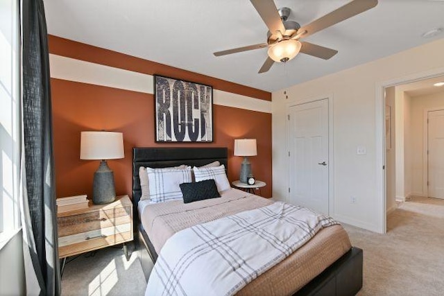 bedroom featuring carpet flooring, a ceiling fan, and baseboards