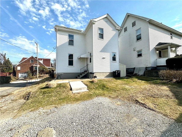 back of house with entry steps