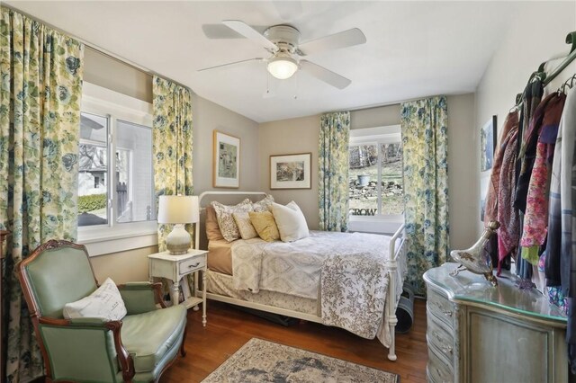 bedroom with wood finished floors and a ceiling fan