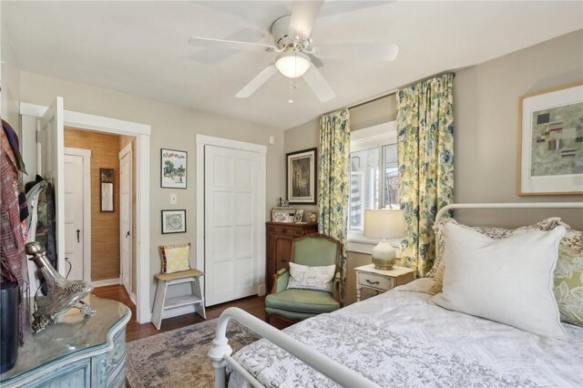 bedroom featuring a closet, a ceiling fan, and wood finished floors