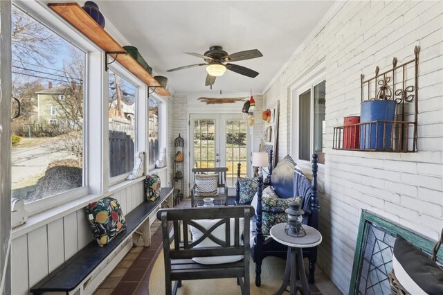 sunroom with a ceiling fan