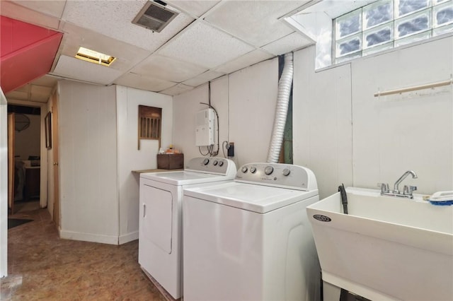 laundry area featuring washer and dryer, laundry area, visible vents, and a sink