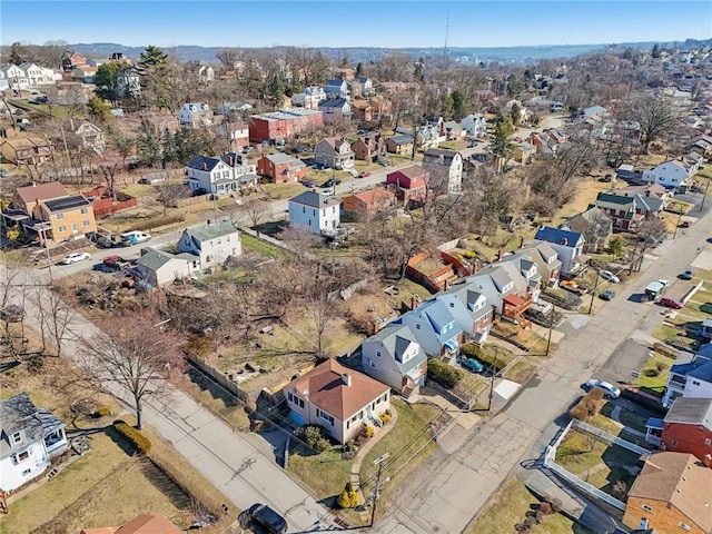 birds eye view of property with a residential view