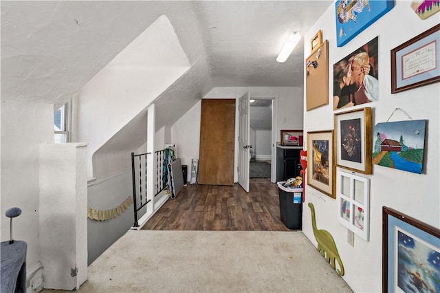 bonus room featuring carpet flooring and wood finished floors