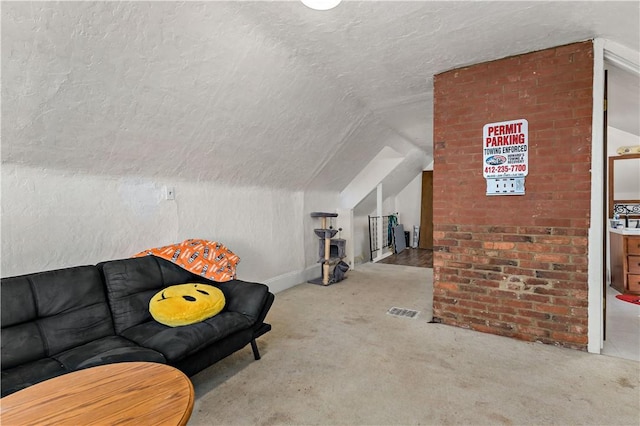 additional living space with a textured ceiling, visible vents, carpet, and vaulted ceiling