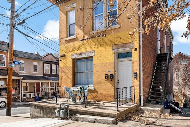 exterior space featuring brick siding