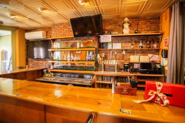 bar with a dry bar, an ornate ceiling, brick wall, and a wall mounted AC