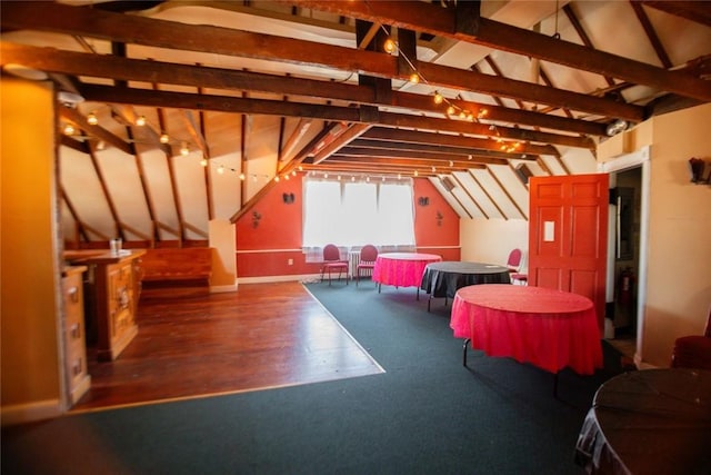 recreation room with lofted ceiling and wood finished floors