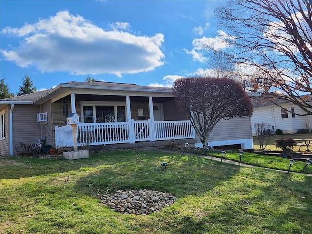 single story home featuring covered porch and a front lawn