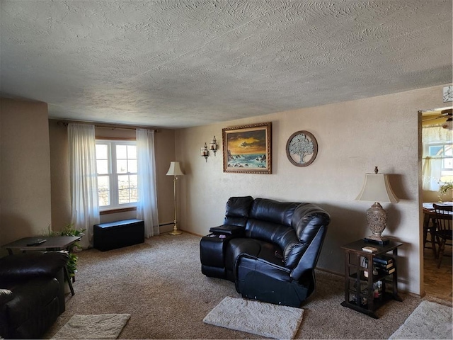 living room featuring a textured ceiling, carpet, and a textured wall