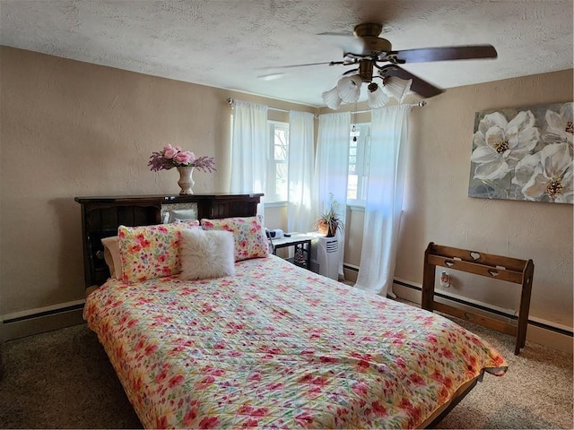 carpeted bedroom with a textured ceiling, ceiling fan, and a textured wall