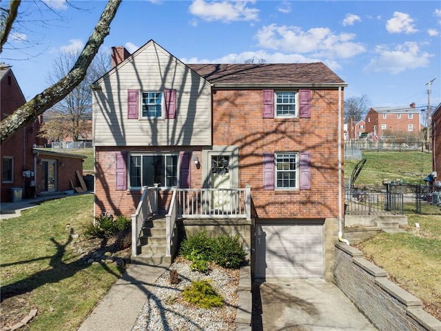 view of front of property featuring a front lawn, a garage, brick siding, and a chimney