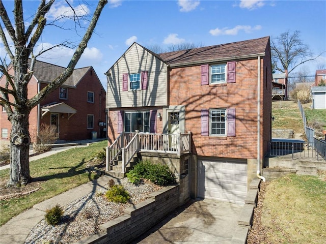 view of front of property featuring a garage, brick siding, and driveway