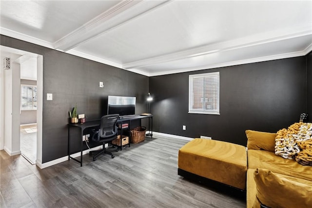 office featuring beam ceiling, crown molding, wood finished floors, and baseboards