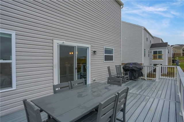 wooden terrace featuring grilling area