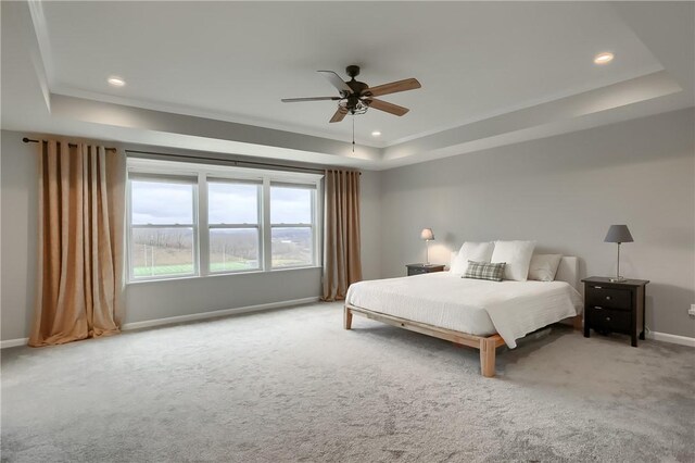 bedroom featuring carpet, baseboards, a ceiling fan, a tray ceiling, and recessed lighting