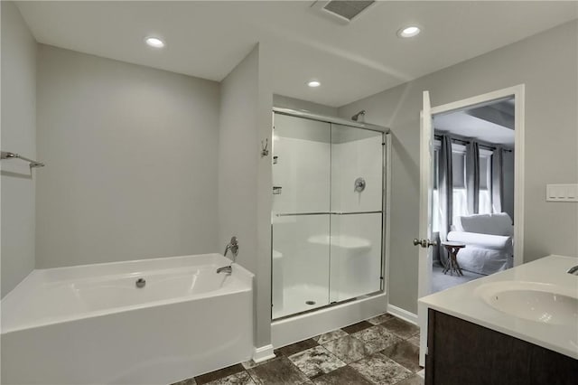 bathroom with recessed lighting, visible vents, a stall shower, and a bath