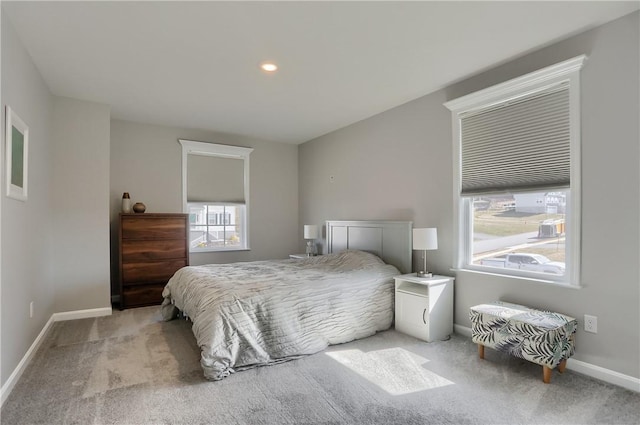 bedroom with carpet flooring and baseboards