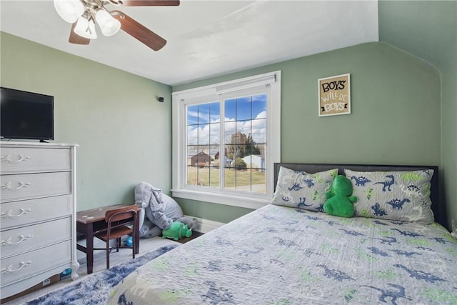 bedroom featuring vaulted ceiling and a ceiling fan