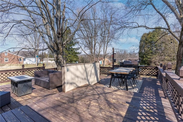 wooden deck with outdoor dining area