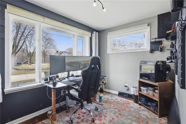 office with wood finished floors and baseboards