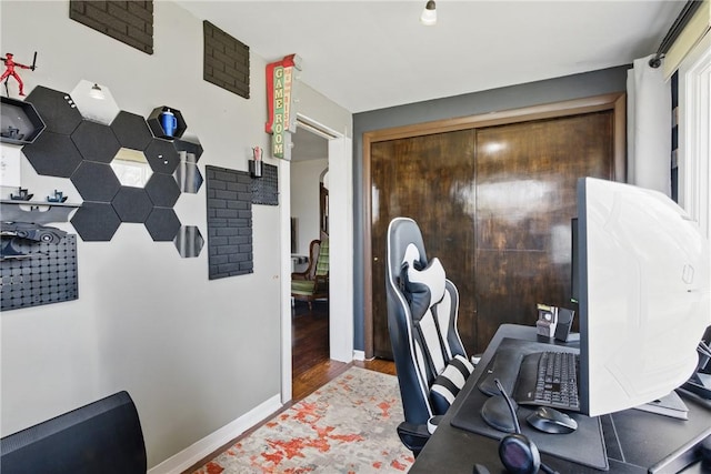 office featuring baseboards and wood finished floors