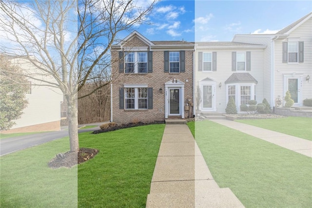 view of front facade with brick siding and a front yard