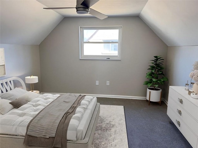 bedroom featuring vaulted ceiling, a ceiling fan, baseboards, and dark colored carpet