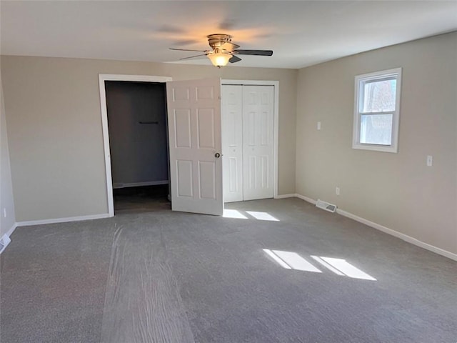 unfurnished bedroom with visible vents, baseboards, and ceiling fan